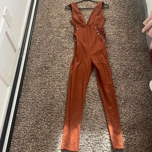 Burnt orange never worn, size medium brand iris